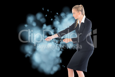 Composite image of businesswoman pulling a rope