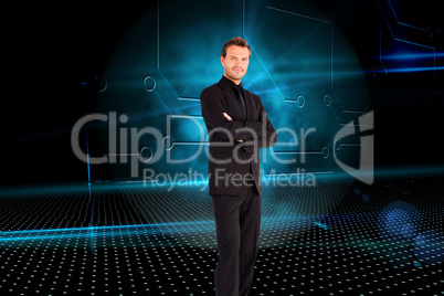 Composite image of handsome businessman with crossed arms