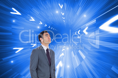 Composite image of unsmiling businessman standing