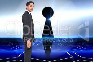 Composite image of unsmiling businessman looking at camera