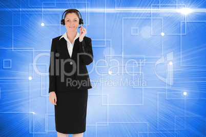 Composite image of good looking woman in suit using headphones a
