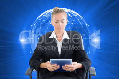 Composite image of businesswoman sitting on swivel chair with ta