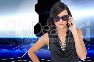 Composite image of serious elegant brunette wearing sunglasses o