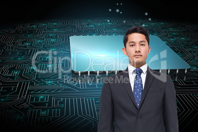 Composite image of stern businessman looking at camera