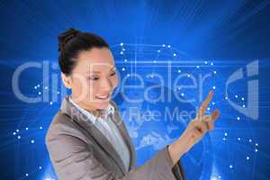 Composite image of smiling asian businesswoman pointing