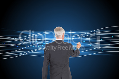 Composite image of rear view of businessman standing and writing