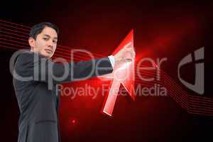 Composite image of serious asian businessman pointing