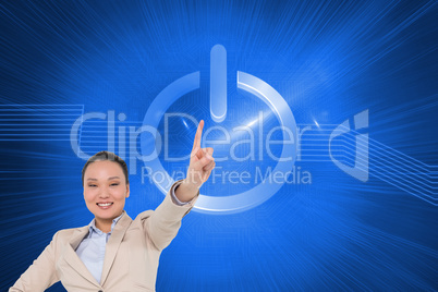 Composite image of smiling asian businesswoman pointing