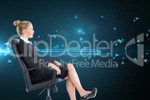 Composite image of businesswoman sitting on swivel chair in blac