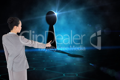 Composite image of unsmiling asian businesswoman pointing