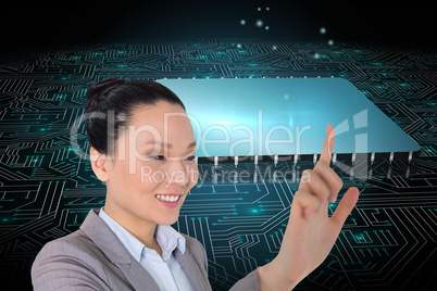 Composite image of smiling asian businesswoman pointing