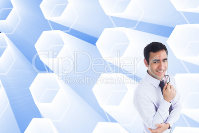 Composite image of smiling businessman holding glasses