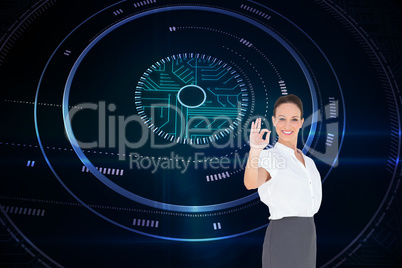 Composite image of elegant businesswoman showing an okay gesture