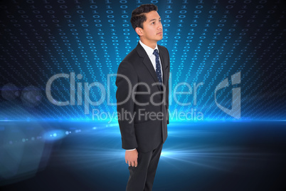 Composite image of frowning businessman looking up