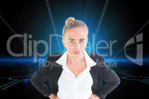 Composite image of businesswoman standing with hands on hips