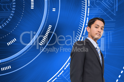 Composite image of serious asian businessman