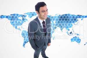 Composite image of smiling businessman standing