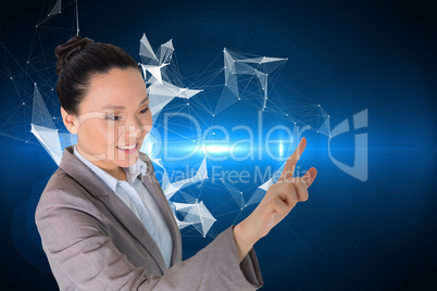 Composite image of smiling asian businesswoman pointing