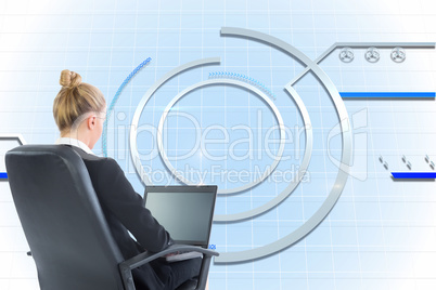 Composite image of businesswoman sitting on swivel chair with la