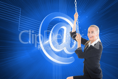 Composite image of businesswoman pulling a chain