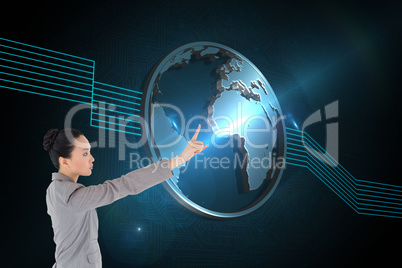 Composite image of unsmiling asian businesswoman pointing