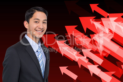 Composite image of smiling asian businessman