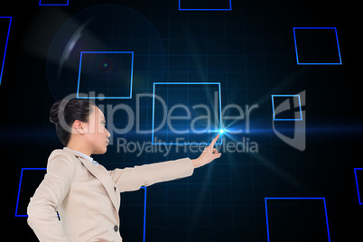 Composite image of unsmiling asian businesswoman pointing