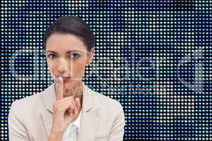 Composite image of young businesswoman asking for silence