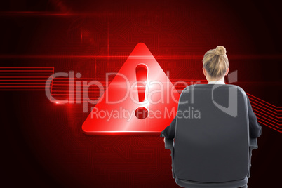 Composite image of businesswoman sitting on swivel chair