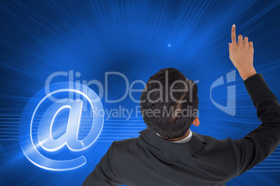 Composite image of asian businessman pointing