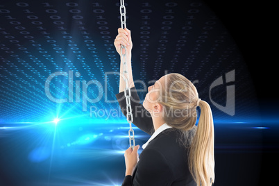 Composite image of businesswoman pulling a chain