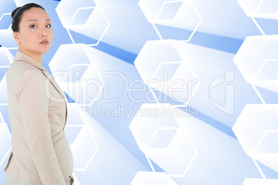 Composite image of unsmiling asian businesswoman