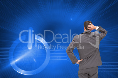 Composite image of young businessman standing back to camera scr