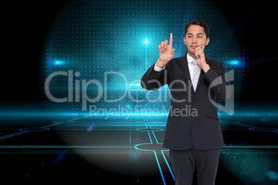 Composite image of thoughtful asian businessman pointing