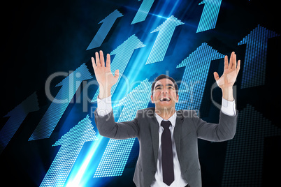 Composite image of excited businessman with arms raised