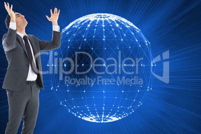 Composite image of unsmiling businessman with arms raised