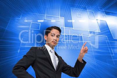 Composite image of unsmiling asian businessman pointing