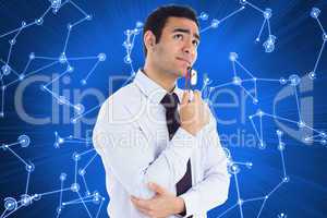 Composite image of thinking businessman holding glasses