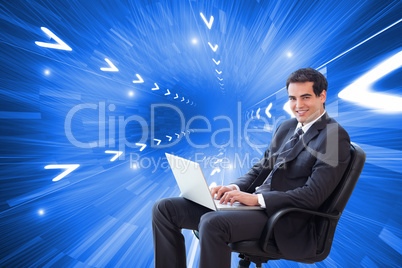 Composite image of young businessman sitting on an armchair work