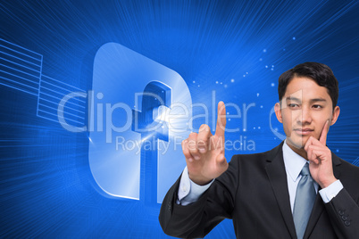 Composite image of thoughtful asian businessman pointing