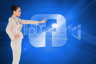 Composite image of unsmiling asian businesswoman pointing