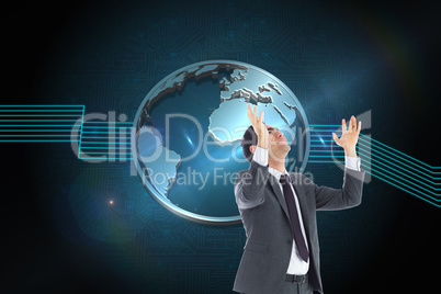 Composite image of happy businessman with arms raised