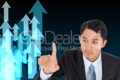 Composite image of unsmiling asian businessman pointing