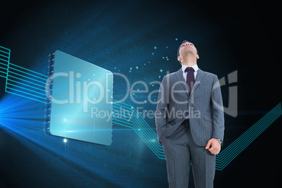 Composite image of businessman standing