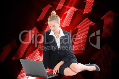 Composite image of businesswoman using laptop Composite image of businesswoman using laptop