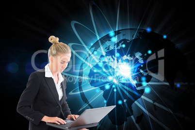 Composite image of businesswoman using laptop