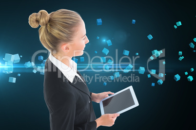 Composite image of businesswoman holding tablet