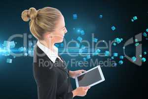 Composite image of businesswoman holding tablet