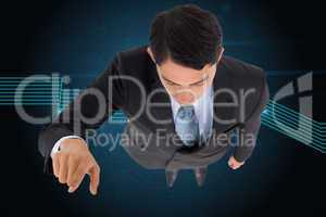 Composite image of unsmiling asian businessman pointing