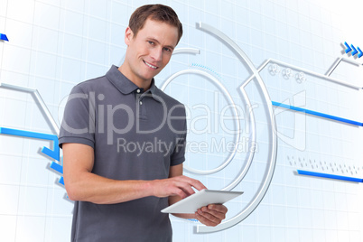 Composite image of smiling young man with tablet computer